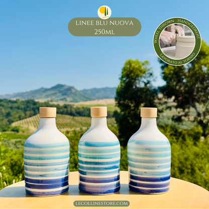 Three small 250ml handcrafted blue ceramic bottles arranged as a coordinated decorative set with Mediterranean character.