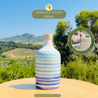 Large blue striped ceramic bottle with hand-painted decoration and cork stopper, ideal for Mediterranean home decor.