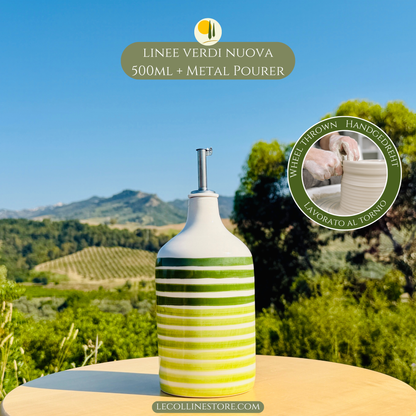 Large handcrafted ceramic bottle with layered green stripes and glossy finish, photographed in natural outdoor light.