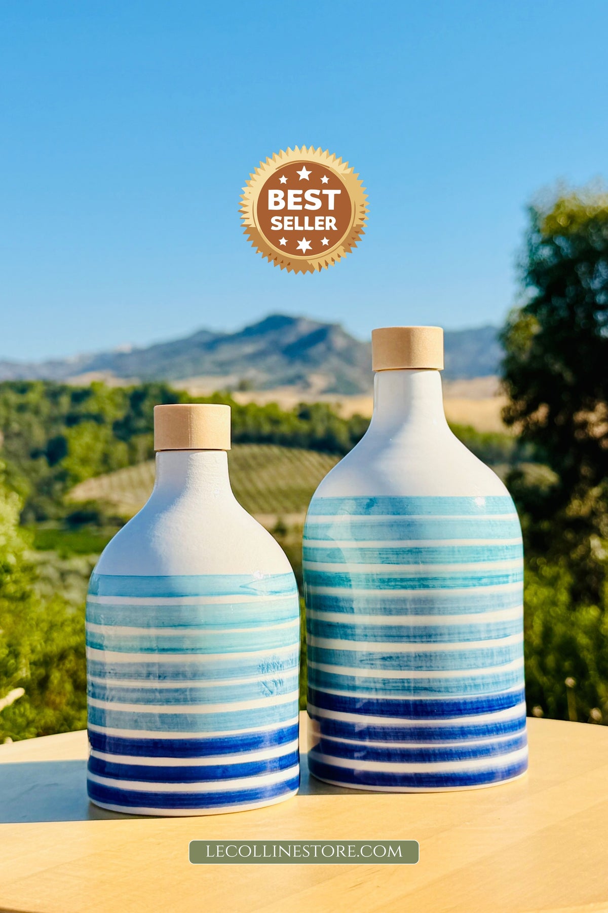 Ceramic bottle oil dispenser with blue lines for olive oil handmade in Italy